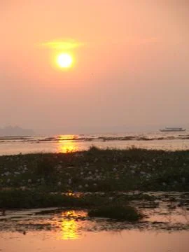 Sunset in River side with Reflection on water beautiful natural beauty Stock Photos