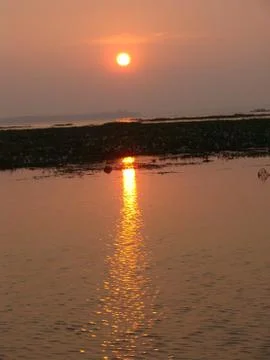 Sunset in River side with Reflection on water beautiful natural beauty Stock Photos