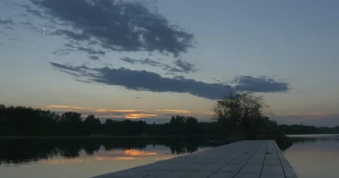 Sunset on The River, Silhouettes of Trees And Sky Reflection in Water Stock Footage 50855076