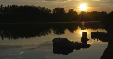 Sunset on The River, Silhouettes of Trees And Sky Reflection in Water Stock Footage 50858239
