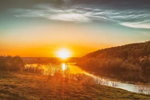 Sunset on the river in summer. Stock Photos