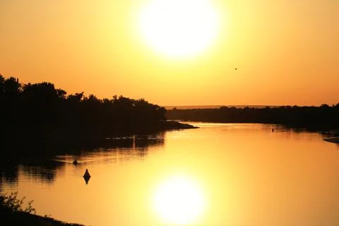 Sunset on the river Twilight Stock Photos