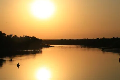 Sunset on the river Twilight Stock Photos