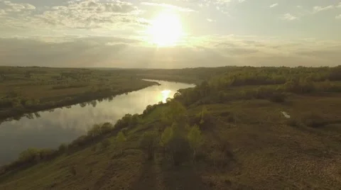 Sunset in a river valley Fly towards the Sun Stockbeeldmateriaal 69069310