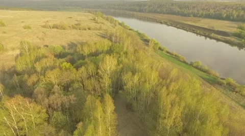 Sunset in a river valley Sun is shining Aerial shot Vidéo 69069202