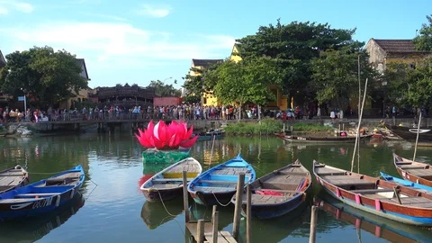Sunset river view with floating lanterns and boats Stock Footage 90186682