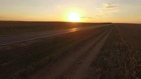 Sunset road with a car Uplift Vídeos de archivo 68863166