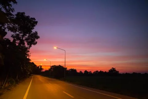 Sunset on the road. Stock Photos