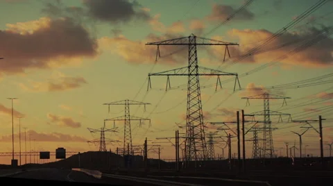 Sunset on road with powerlines, graded Stock Footage 57337336
