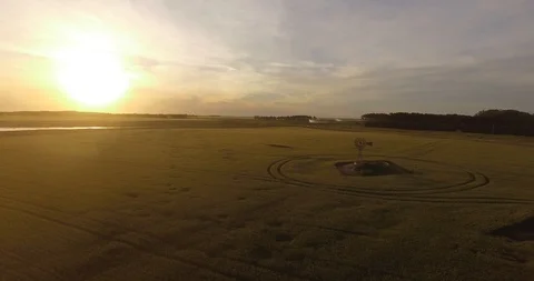 Sunset on the road with wheat fields 動画素材 116183248