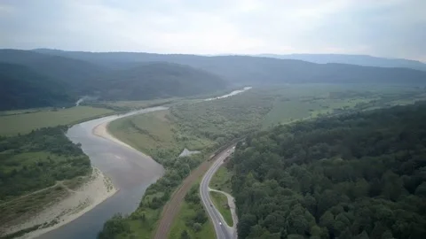 Sunset road winding in Carpathians mountains. Ukraine Stock Footage 233024013