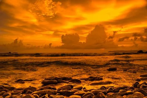 Sunset at the rocky beach in Papuma, Jember, East Java, Indonesia Stock-Fotos