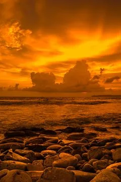 Sunset at the rocky beach in Papuma, Jember, East Java, Indonesia Stock-Fotos