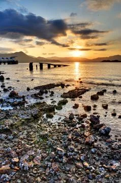 Sunset rocky beach Stock Photos