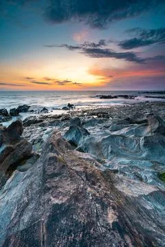 Sunset at the rocky beach at Vila Nova de Gaia, Portugal Stock Photos