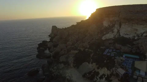 Sunset by rocky cliffs Stock Footage 66260644