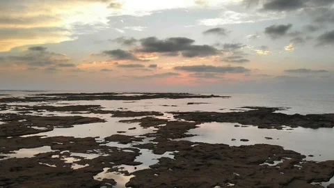 Sunset at a rocky coast Stock Footage 97450266