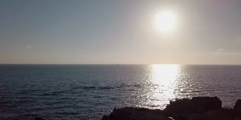 The sunset on rocky coast Stock Footage 98387135