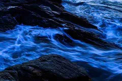 Sunset on a rocky shore. Stock Photos