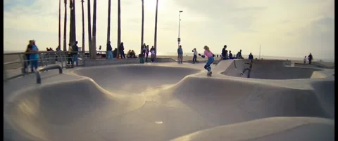 Sunset Roller Skating in Venice Beach Skate Bowl – Wide Cinematic Shot Stock Footage 322136151