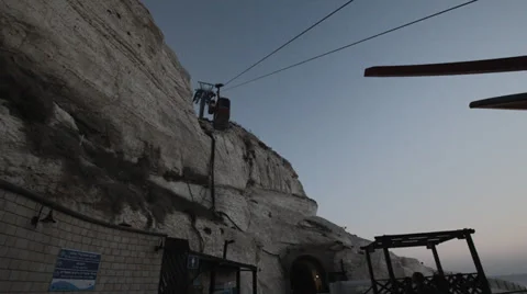 Sunset at Rosh Hanikra grottoes - cable car oing down Stock Footage 34258980