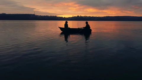 Sunset Rowing: A Couple's Silhouette on the Lake Stock-Footage 271459349