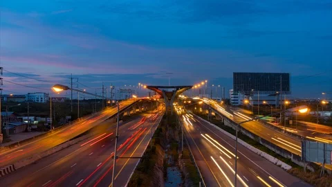 The sunset is rush hour. On the highway at dense traffic Stock Footage 104613663