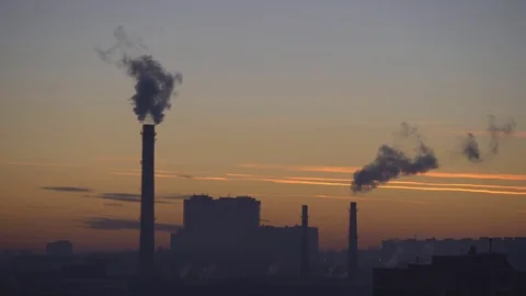 Sunset in the Russian city. There is a trail from the flying plane in the sky. Stock Footage 84434664