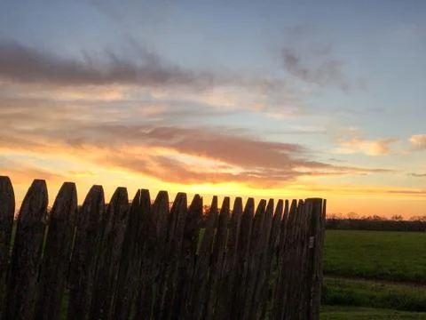 Sunset with rustic wood fence Stock Photos