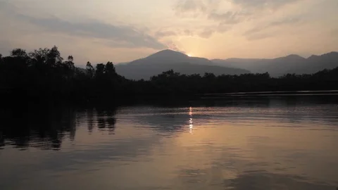 Sunset sailing on a river in Cambodia Stock Footage 129301400