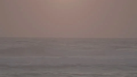 Sunset  on sand beach with waves slow motion 動画素材 233352388