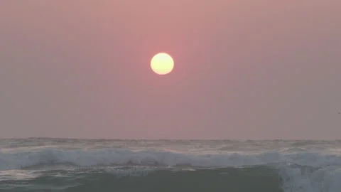 Sunset on sand beach with waves slow motion 動画素材 233354361