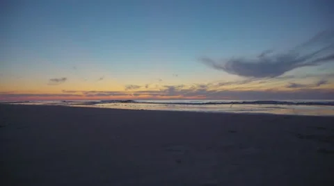 Sunset on sandy beach Stock Footage