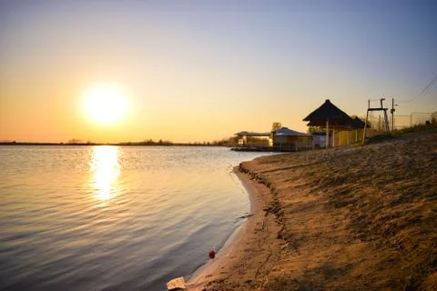 A sunset on the sandy beach Stock Photos