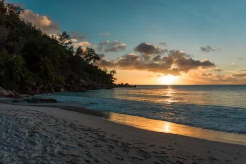Sunset at a sandy beach in Seychelles Stock Photos