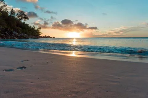 Sunset at a sandy beach in Seychelles Stock Photos
