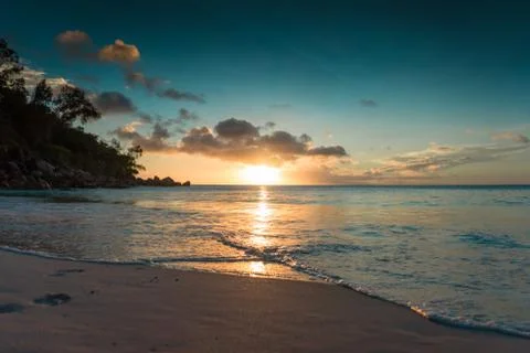 Sunset at a sandy beach in Seychelles Stock Photos