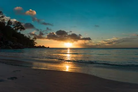 Sunset at a sandy beach in Seychelles Stock Photos
