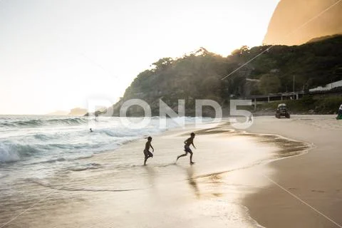 Sunset at Sao Conrado beach, Rio de Janeiro Stock Photos