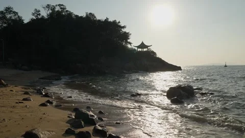 Sunset scene and silhouette at beach in Lamma Island, Hong Kong - 4k Stock Footage 296327476