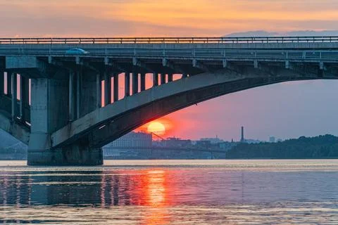 A sunset scene featuring the serene Chain Bridge, a suspension bridge spannin Stock Photos