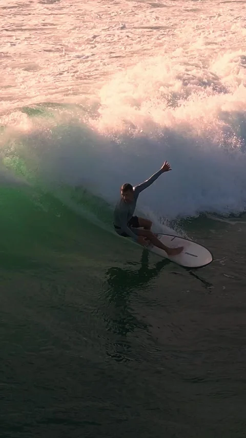 Sunset Scene Of Skilled Surfer Performing Dynamic Wave Maneuver Stock Footage 326252463