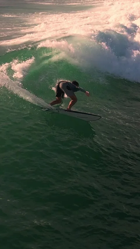 Sunset Scene Of Skilled Surfer Performing Dynamic Wave Maneuver Stock Footage 326252547