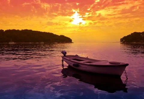 Sunset scene with a small boat Stockfoto's