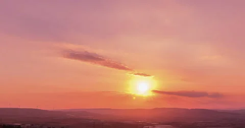 Sunset scene with sun fall behind the clouds in background, time lapse shot Stock Footage 67196829