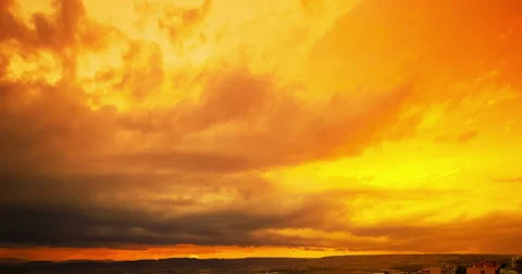 Sunset scene with sun fall behind the clouds in background, time lapse shot Видео 67638037