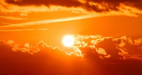 Sunset scene with sun fall behind the clouds and mountains Stock Footage 103143362