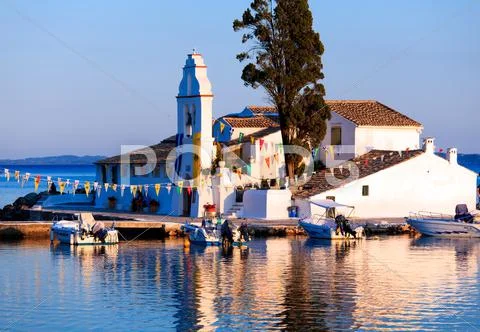 Sunset scene of vlacherna monastery, kanoni, corfu, greece Stock Photos
