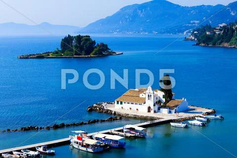 Sunset scene of vlacherna monastery, kanoni, corfu, greece Stock Photos