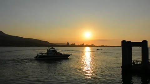 Sunset scenery with silhouette of ships Stock Footage 44349631